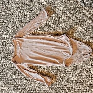 Kyte Baby Longsleeve Bodysuit in Porcelain 6-12 Months